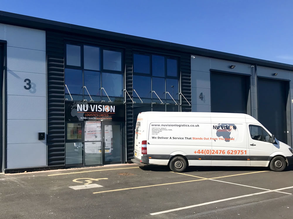 The Nu Vision Logistics warehouse exterior with a van parked outside