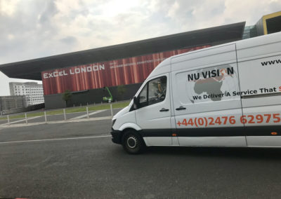 A Nu Vision Logistics van driving past Excel London
